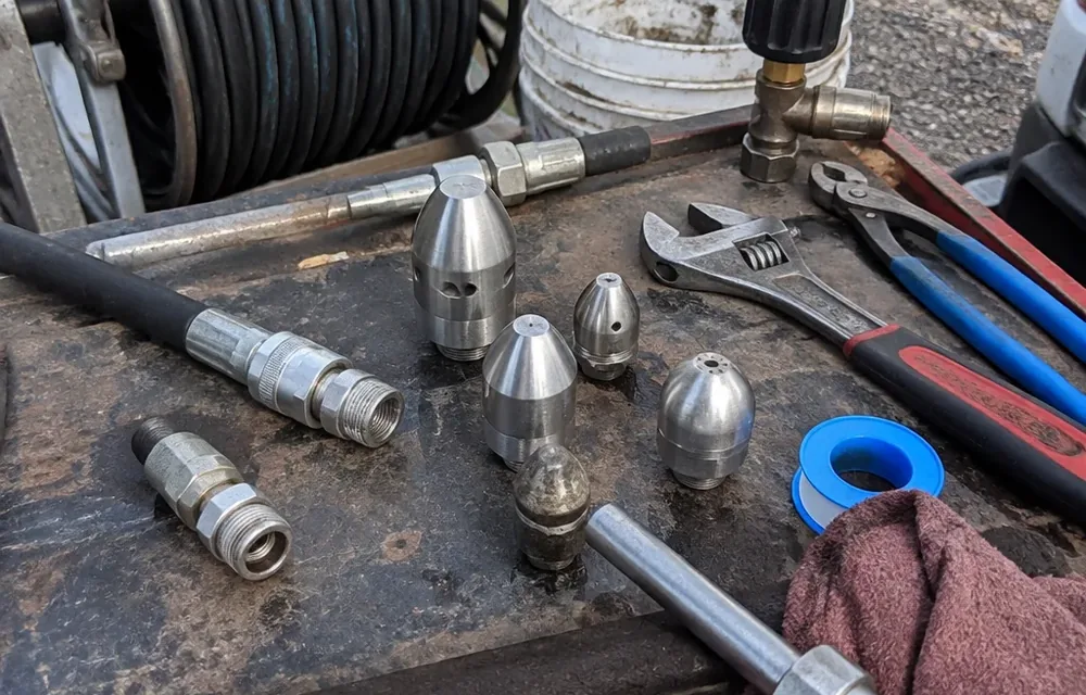 Close-up detail of hydro jetting parts and tools