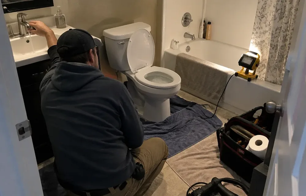 Toilet and tub tested together during gurgling drain diagnosis