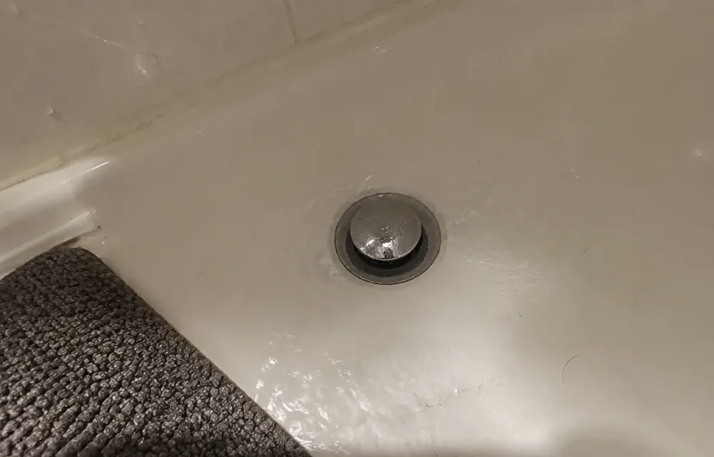 Slow tub drain holding shallow water around the stopper in Chelmsford